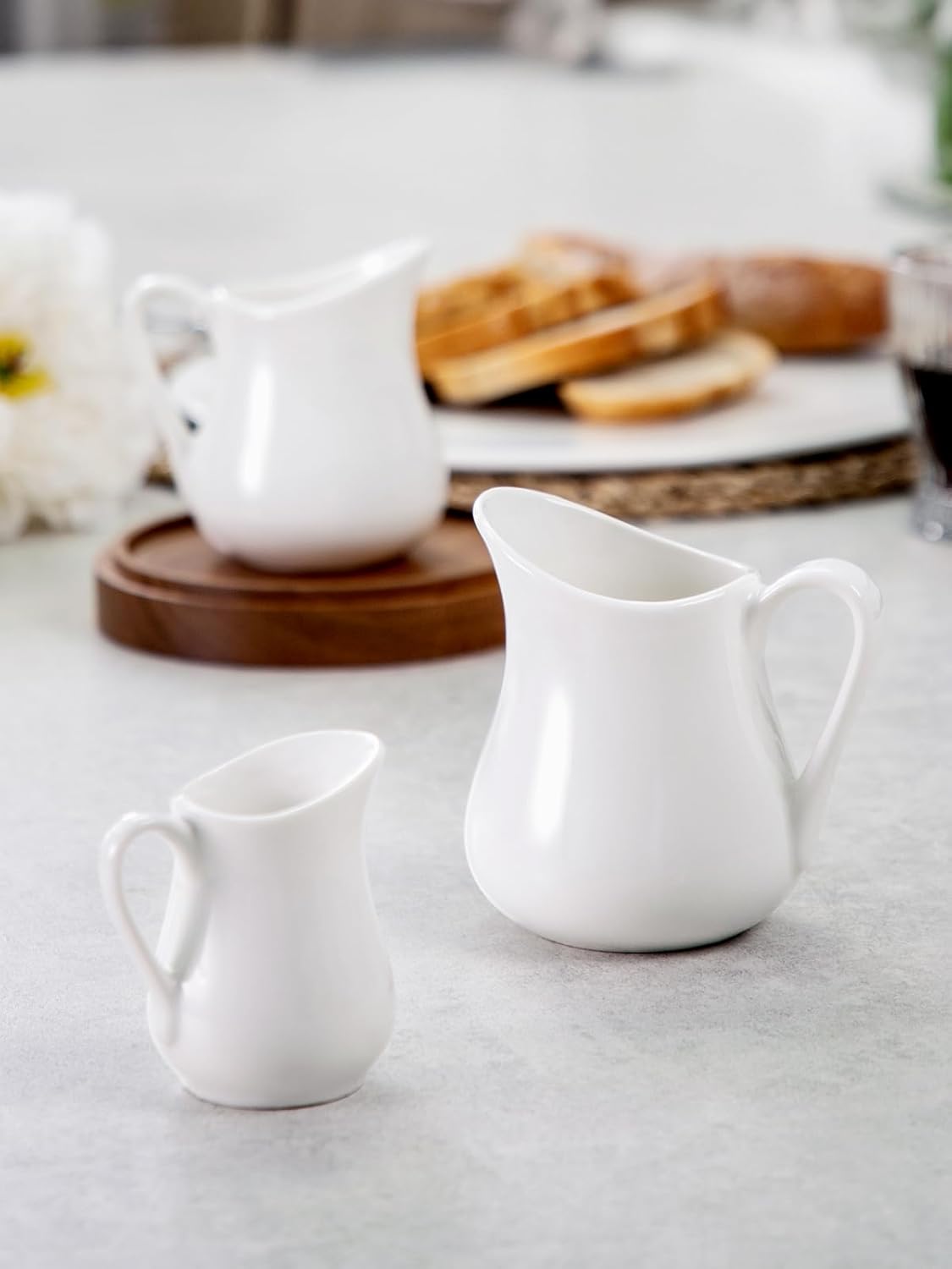 Nucookery Ceramic 4 Oz Creamer Pitcher Set, 2 Pack Creamer Container, White Small Milk Pitcher Container Cups with Handle For Sauces Salad Coffee Milk, Microwave & Freezer Safe, Set of 2